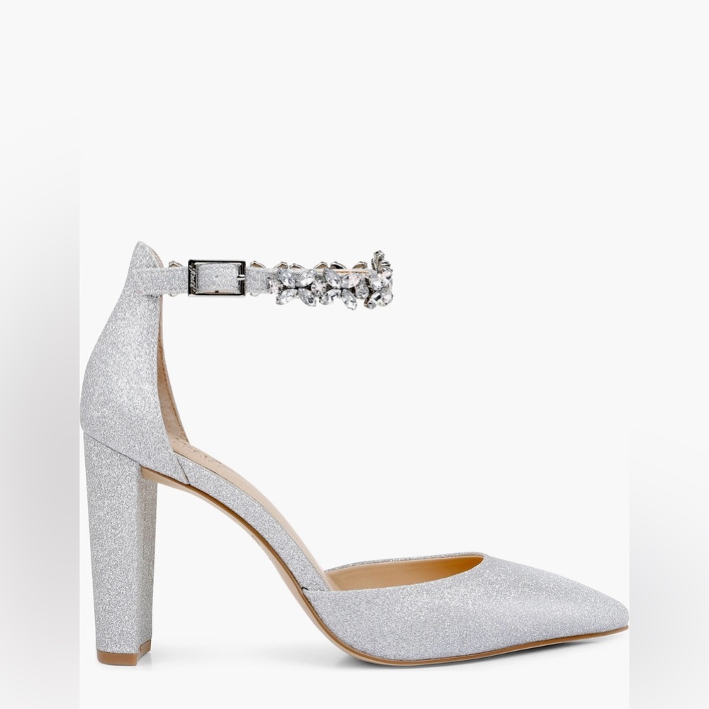 Crystals glisten from the delicate ankle strap of this pointy-toe pump